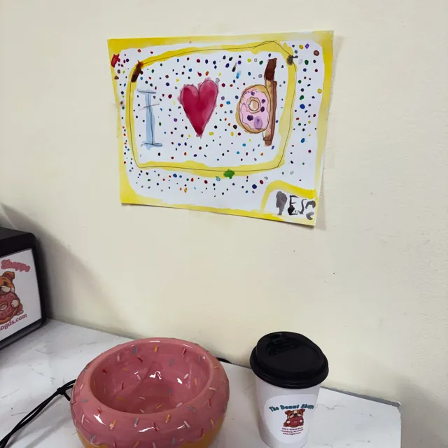Hand-drawn heart sign taped to the wall